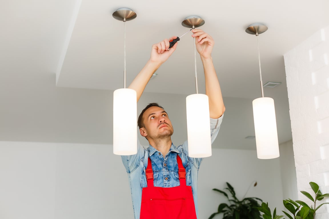 Electrician Man Worker Installing Ceiling Lamp